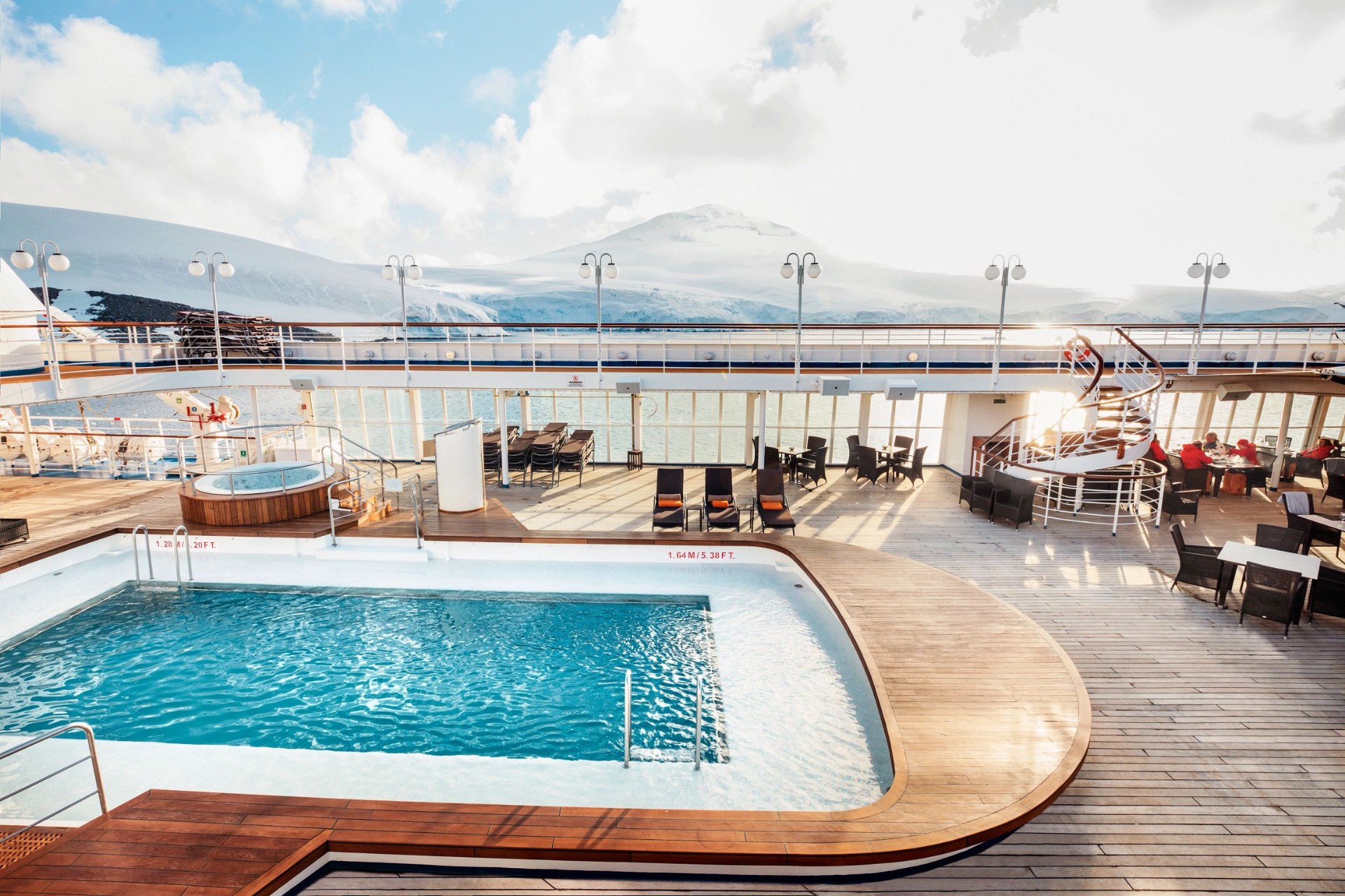 Open pool deck with loungers and panoramic ocean views